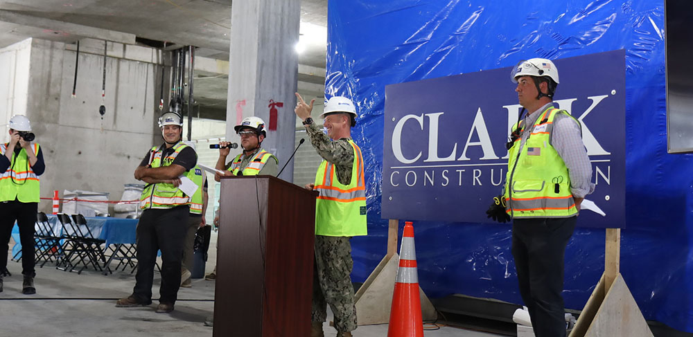 Members of the Clark team joined representatives from the Naval Facilities Engineering Systems Command (NAVFAC), the Defense Health Agency (DHA), Medical Facilities Program Office (MFPO), Walter Reed National Military Medical Center Command (WRNMMC), and the project’s craftworkers on Friday to commemorate the milestone with a topping out celebration.