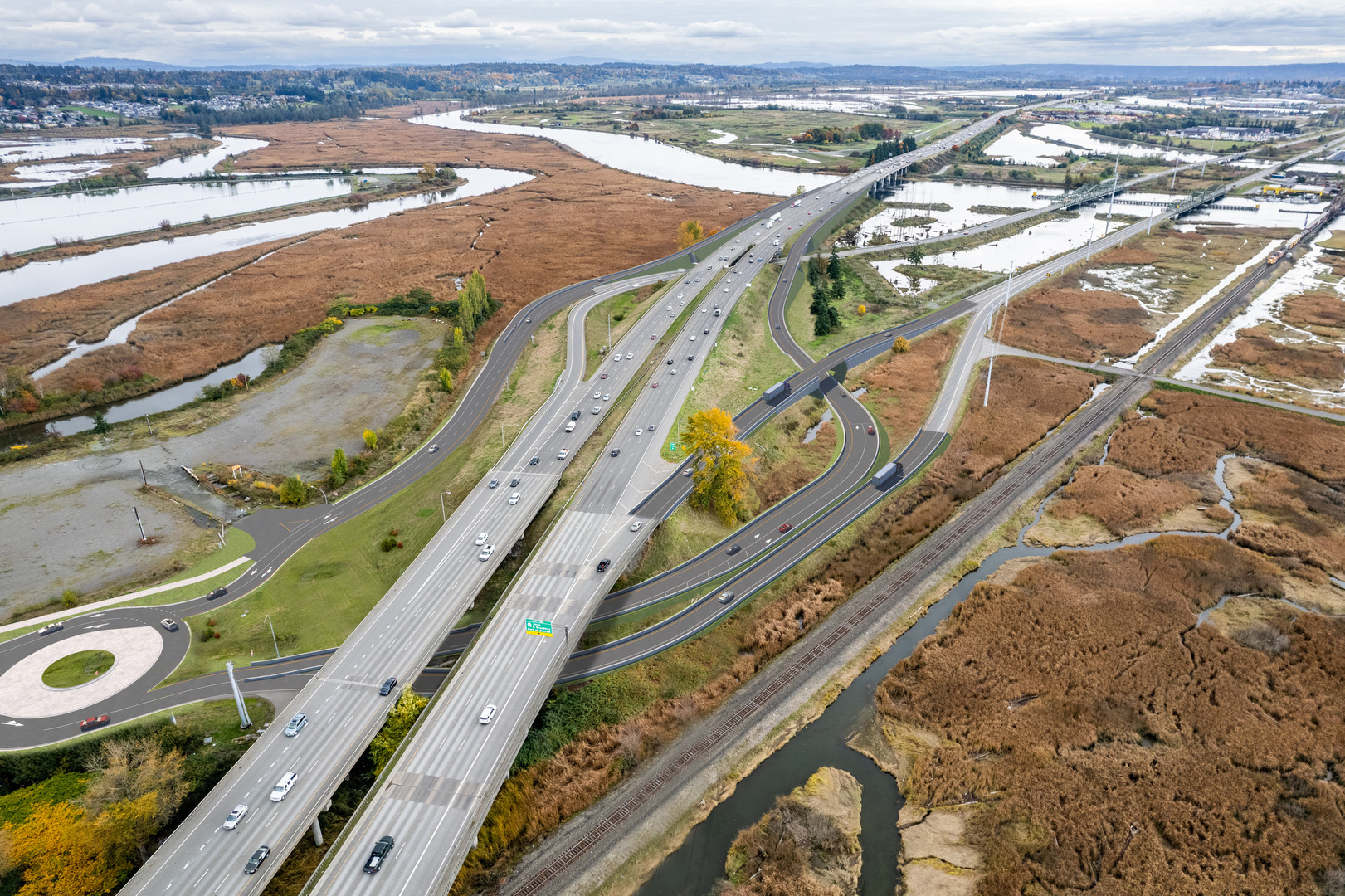 Aeriel view of a Washington State Department of Transportation roadway with trees and water