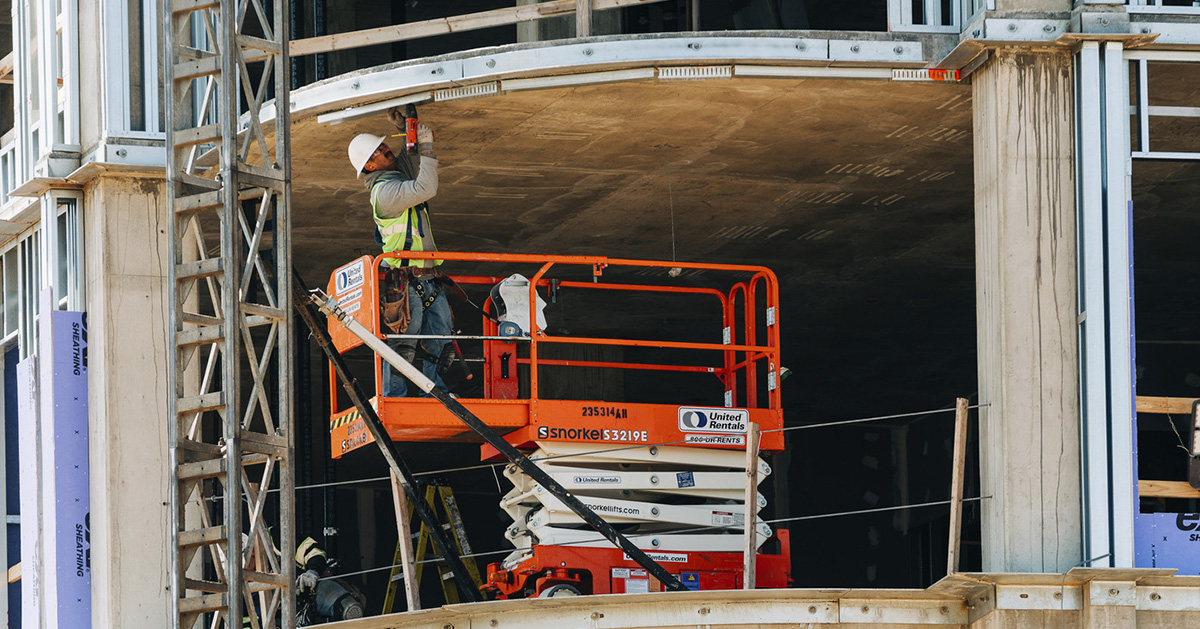 Craft worker in action; Twinbrook Quarter Phase 1 Progress Photography