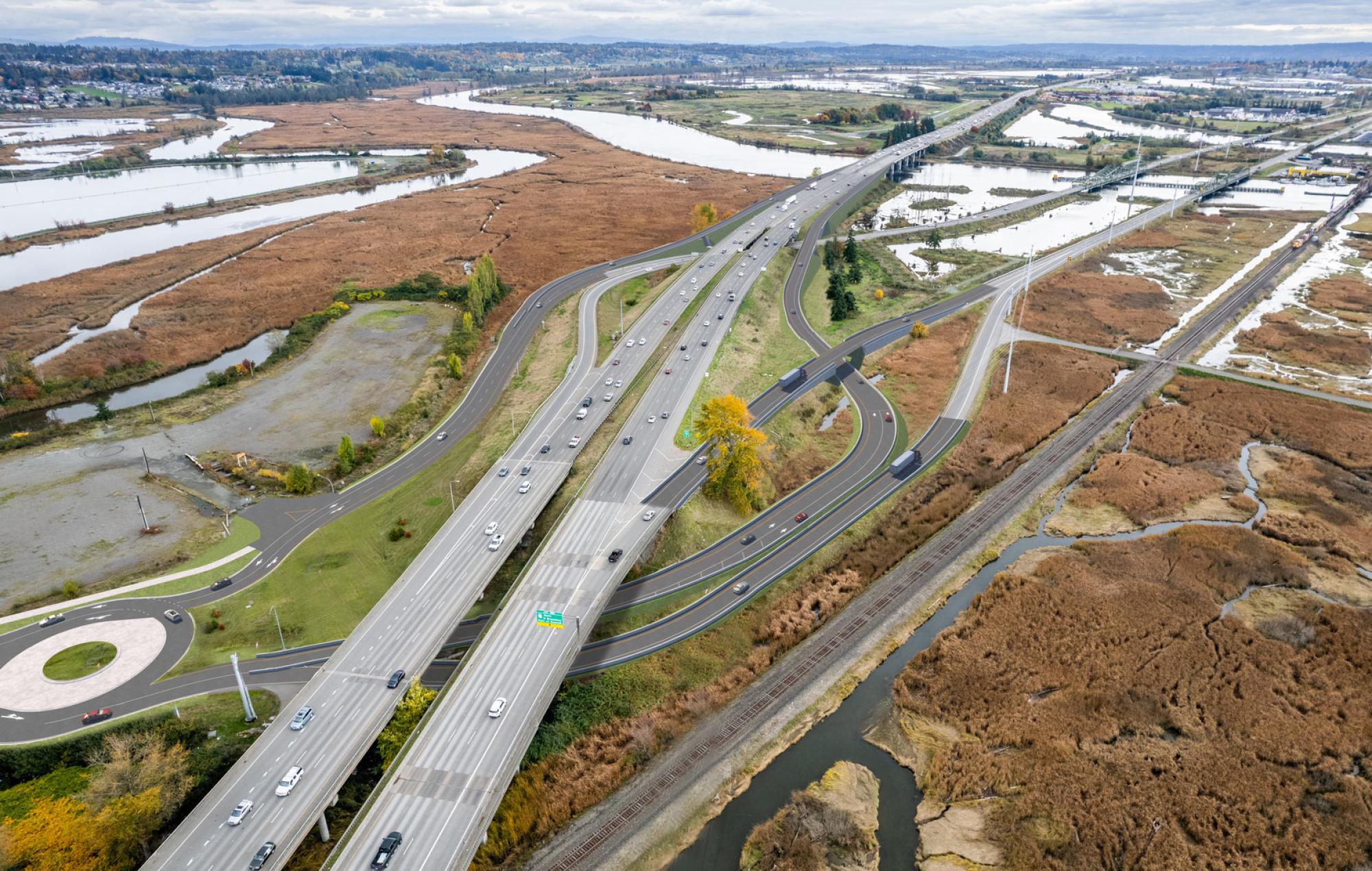 Aeriel view of a Washington State Department of Transportation roadway with trees and water