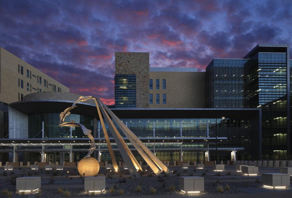 William Beaumont Army Medical center at night with purple clouds